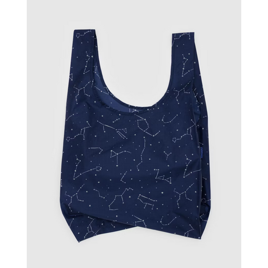 Navy blue reusable tote bag featuring an all over constellation print.