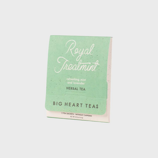 Tea bag with a mint green label featuring the flavor "Royal Treatmint" in white cursive above the words "refreshing mint and lavender herbal tea" and the brand name "Big Heart Tea Co" in black lettering.