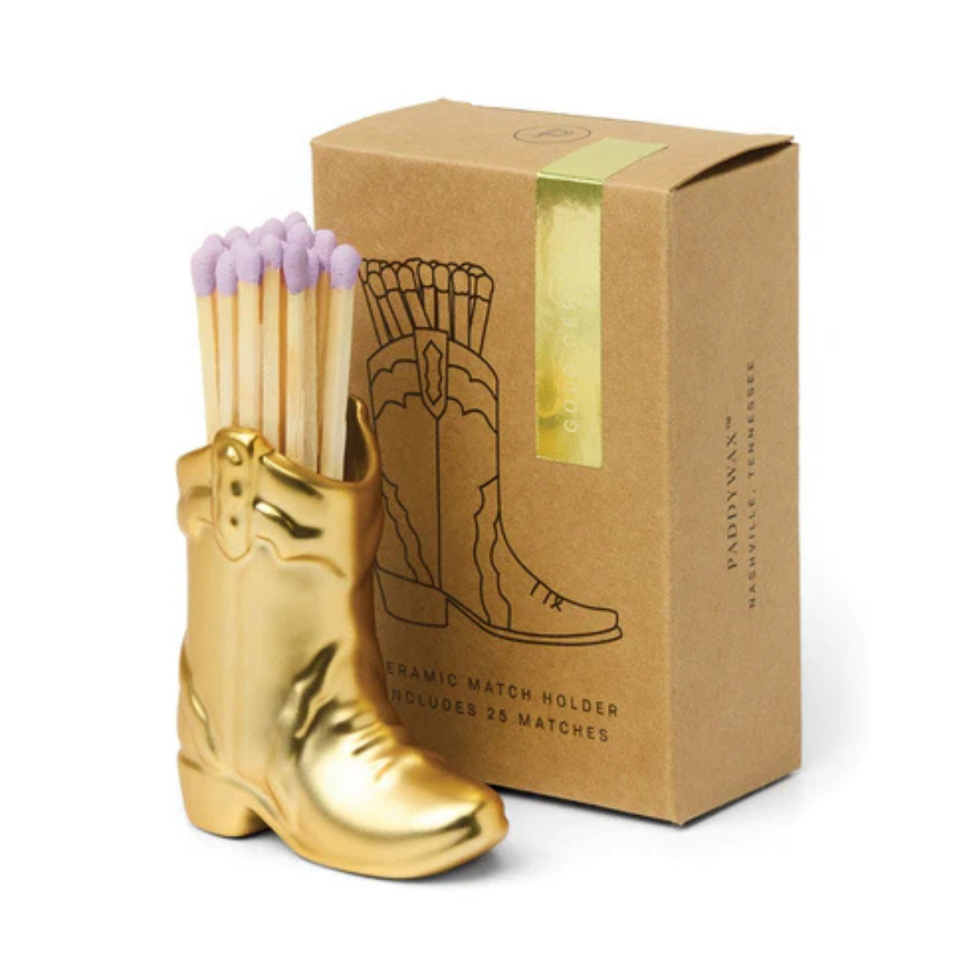 Gold boot-shaped match holder with matches and a matching gift box 
