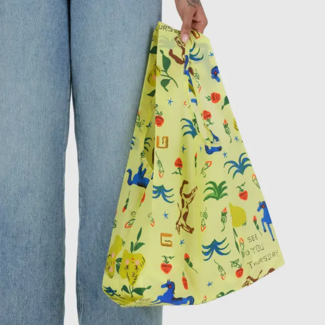 Model holding the shopping bag