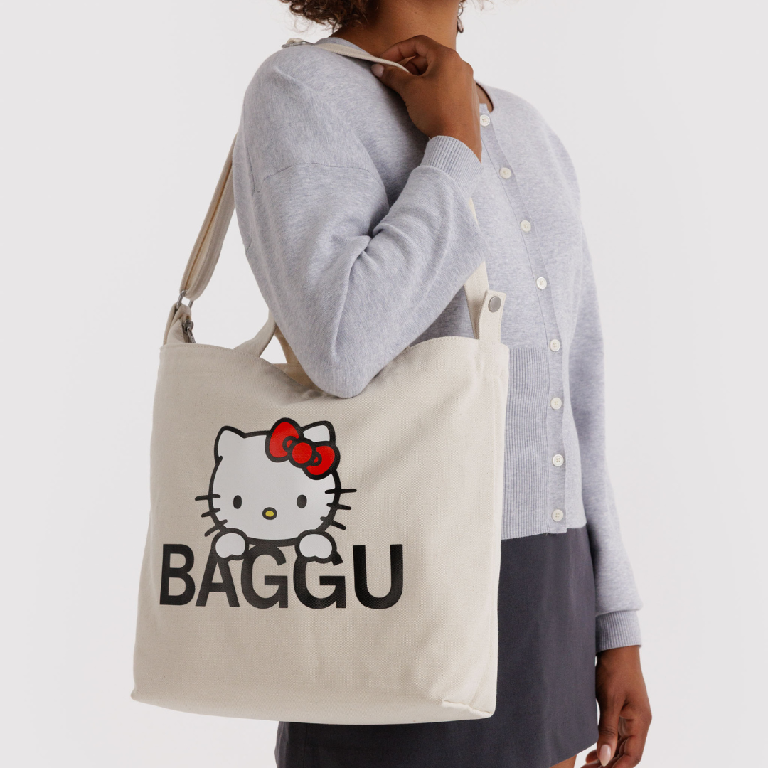 Model wears the Hello Kitty Baggu tote on their shoulder