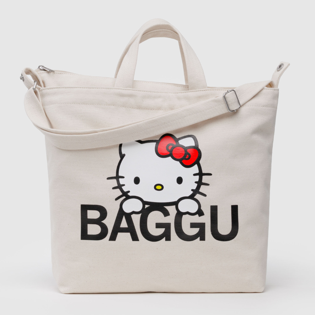 Natural cotton duck bag with an image of Hello Kitty over the Baggu logo
