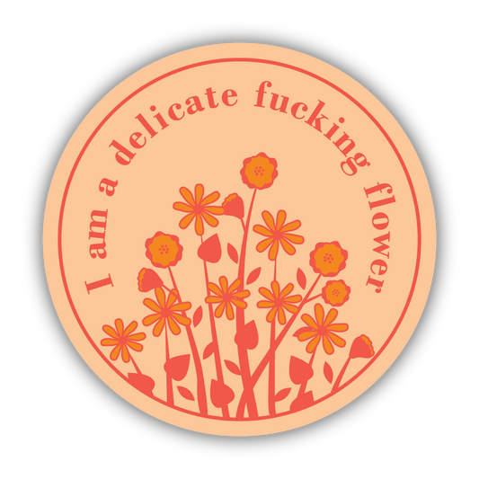 Circular sticker with floral design on a peach background. Text reads "I am a delicate fucking flower"