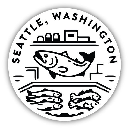 Circular sticker with a black and white image of a fish market with a flying fish that says "Seattle, Washington"
