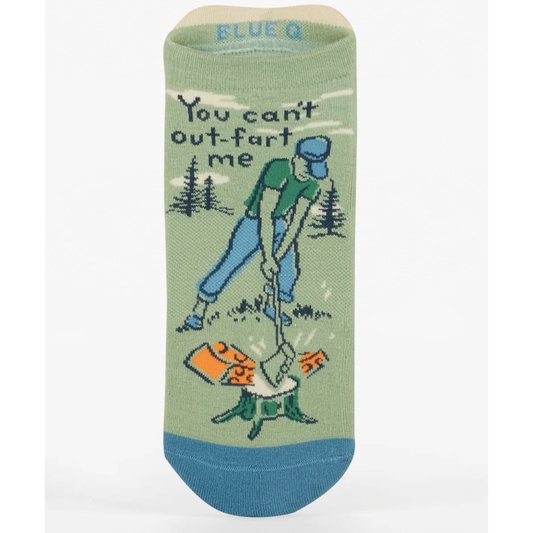 Green and blue ankle sock with a man outdoors cutting cheese with an ax that says "You can't out-fart me"