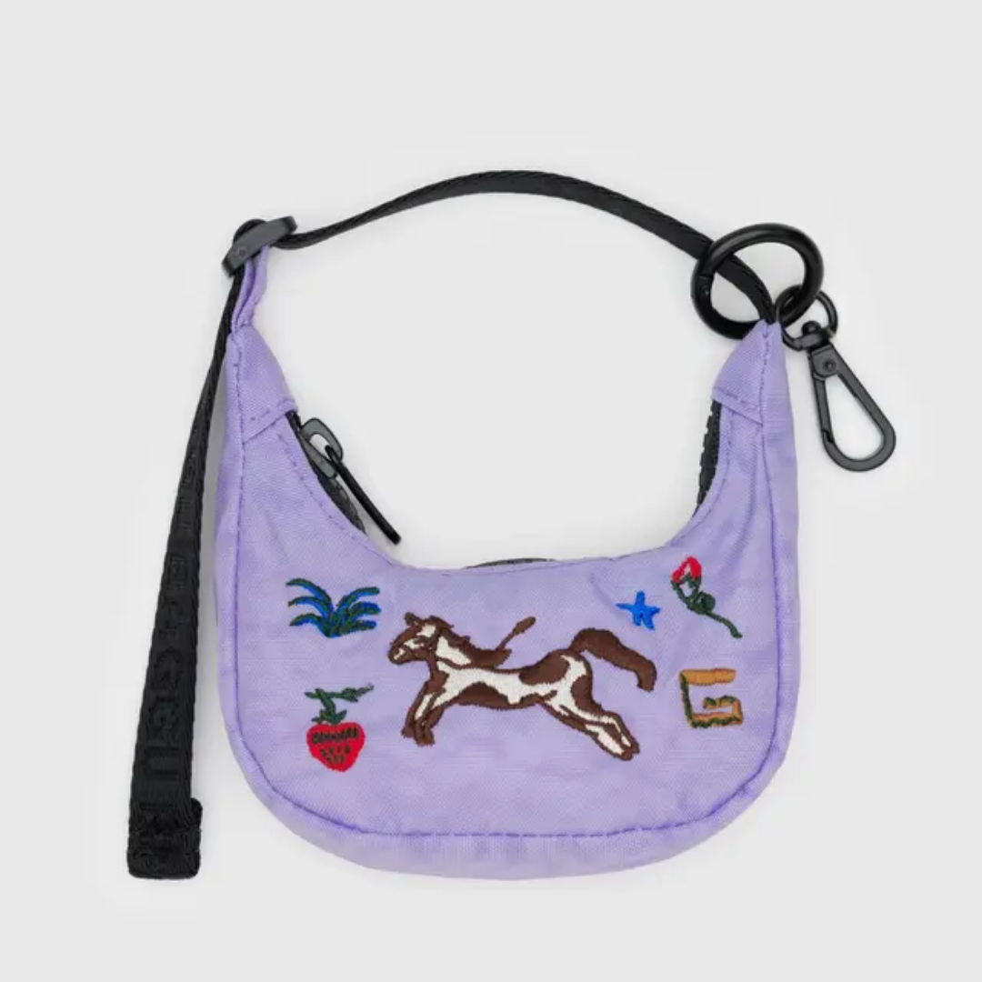 Light purple crescent shaped bag harm with an embroidered pony motif