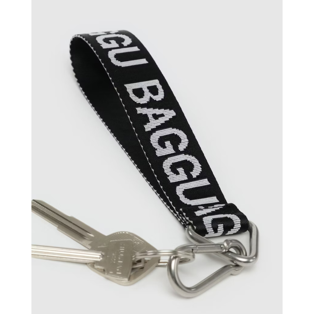 Black lanyard with the word "BAGGU" in white font and a silver keychain and carabiner attached.