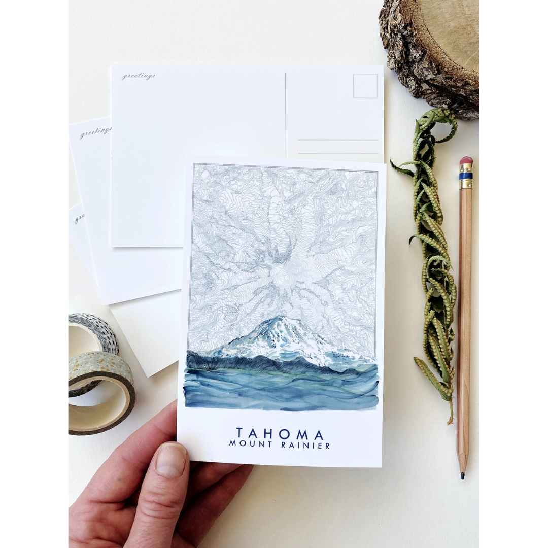 Postcard featuring Mount Rainier blended with a topographical view of Mount Rainier in several hues of blue. The words "TAHOMA MOUNT RAINIER" sit underneath it.