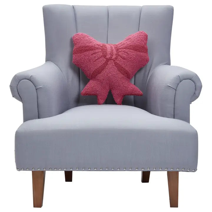 Bow pillow on a chair for scale