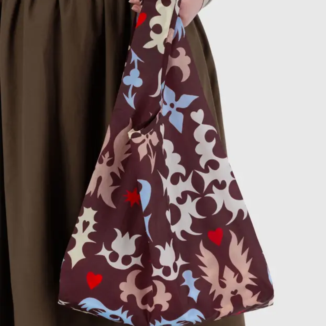 Model holding shopping bag