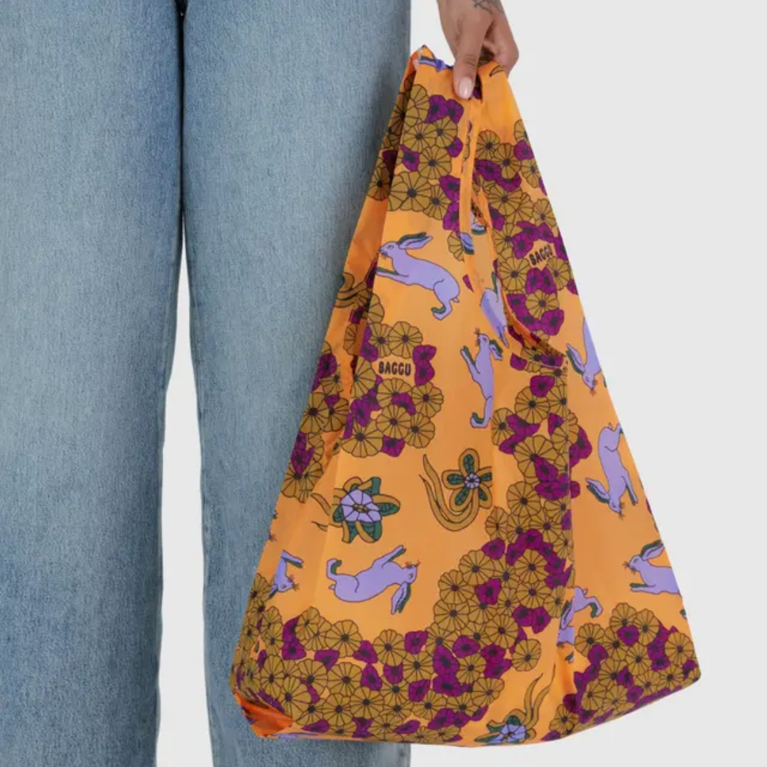 Model holding shopping bag