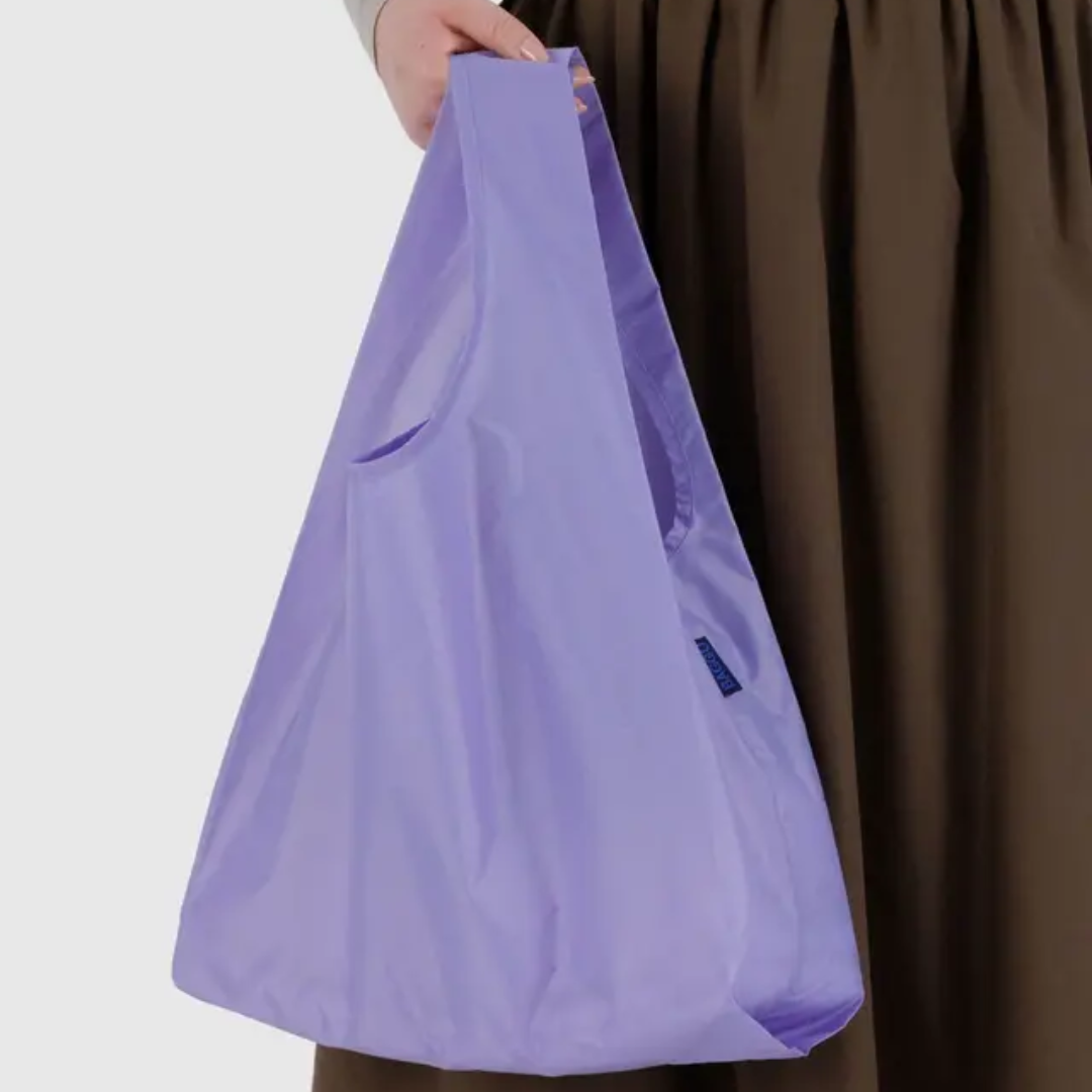 Model holding shopping bag
