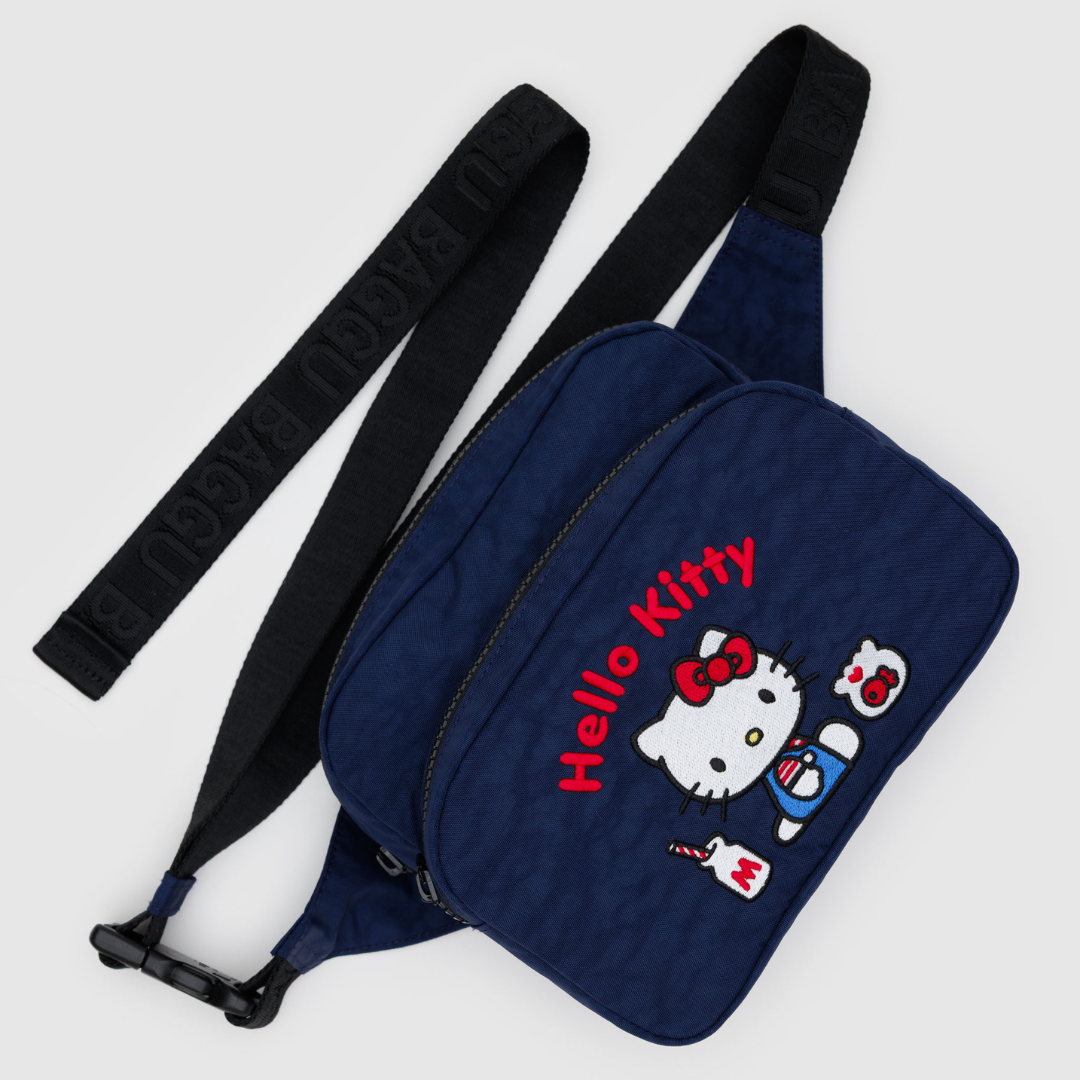 Navy fanny pack with black strap and embroidered Hello Kitty design