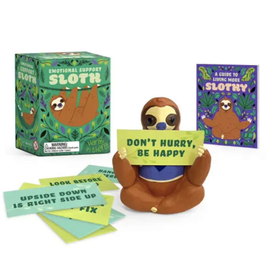 Sloth figurine holding a sign with cards and packaging on a white background