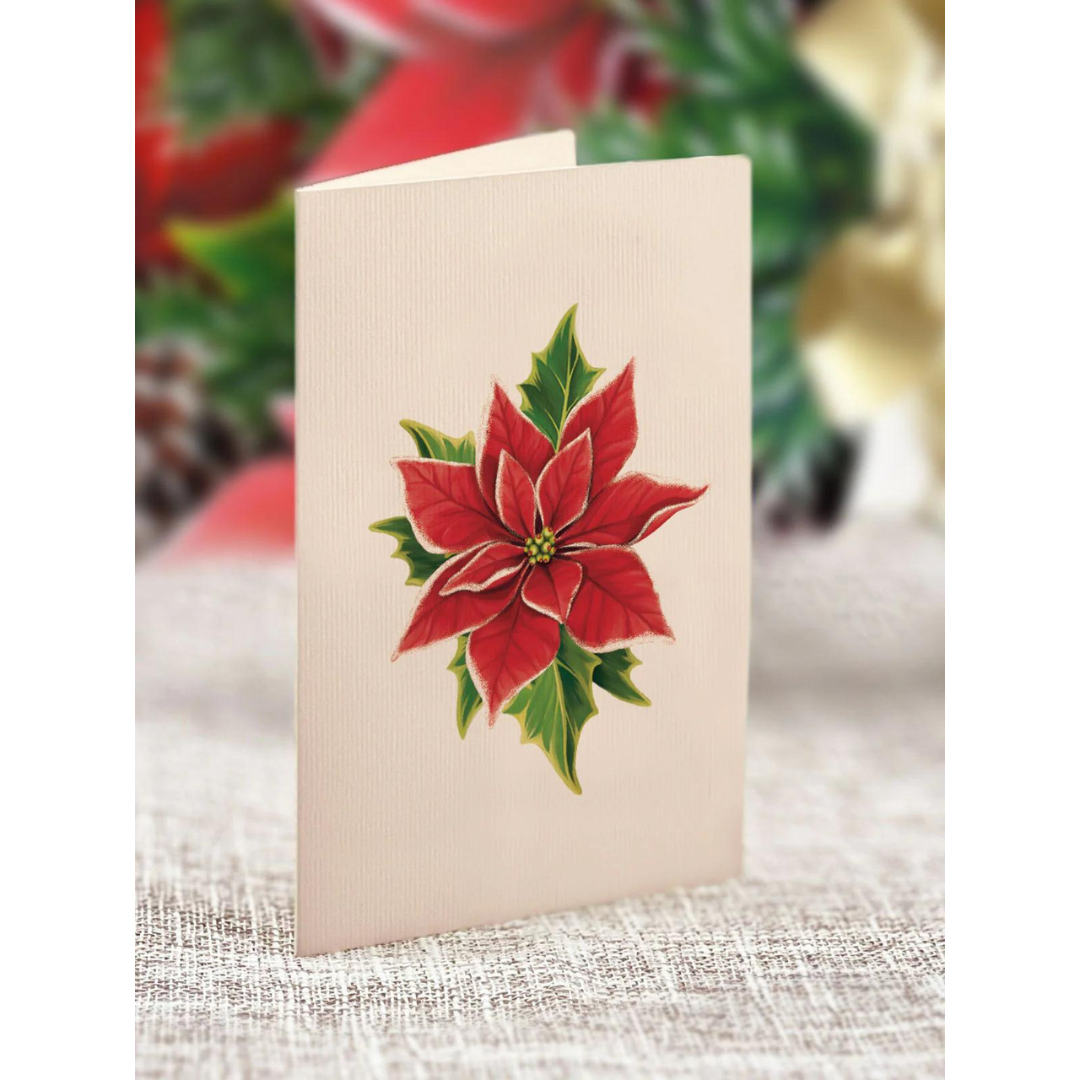 Off-white greeting card featuring a bright red poinsettia and green leaves.