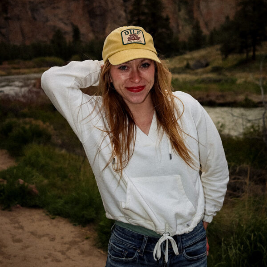 Model wearing the DILF cap in gold