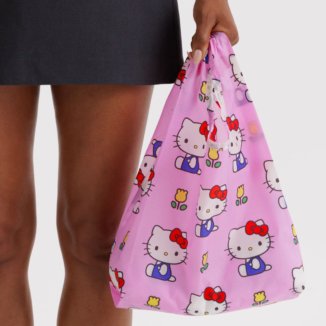 Model holding baby baggu