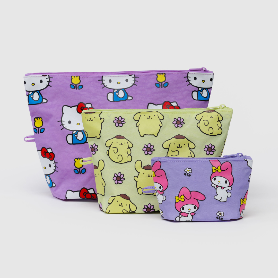 Three pouches- small, medium, and large, decorated with Sanrio characters- My Melody (small), Pompompurin (medium), and Hello Kitty (large)