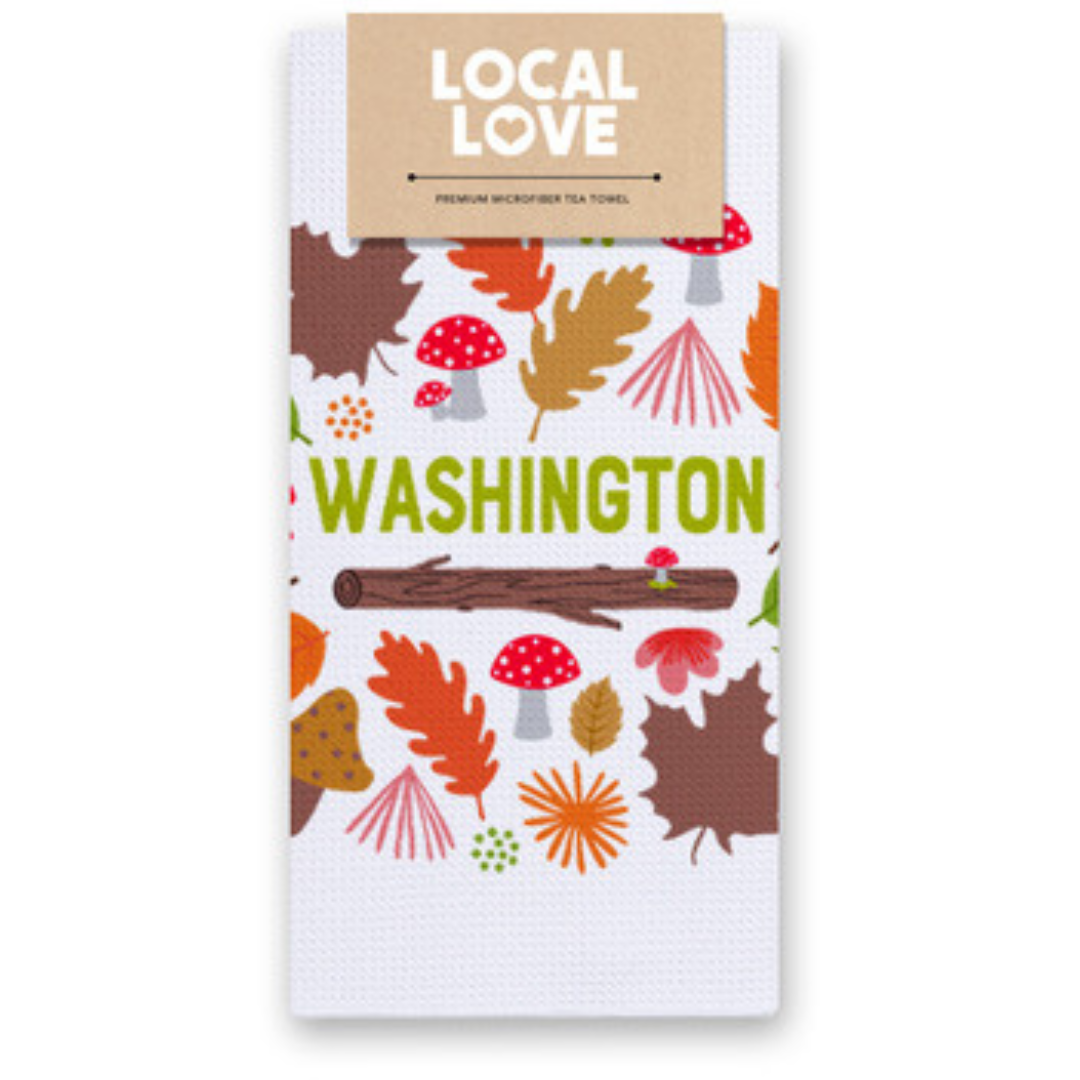 Washington tea towel with woodland design of leaves, logs, and mushrooms