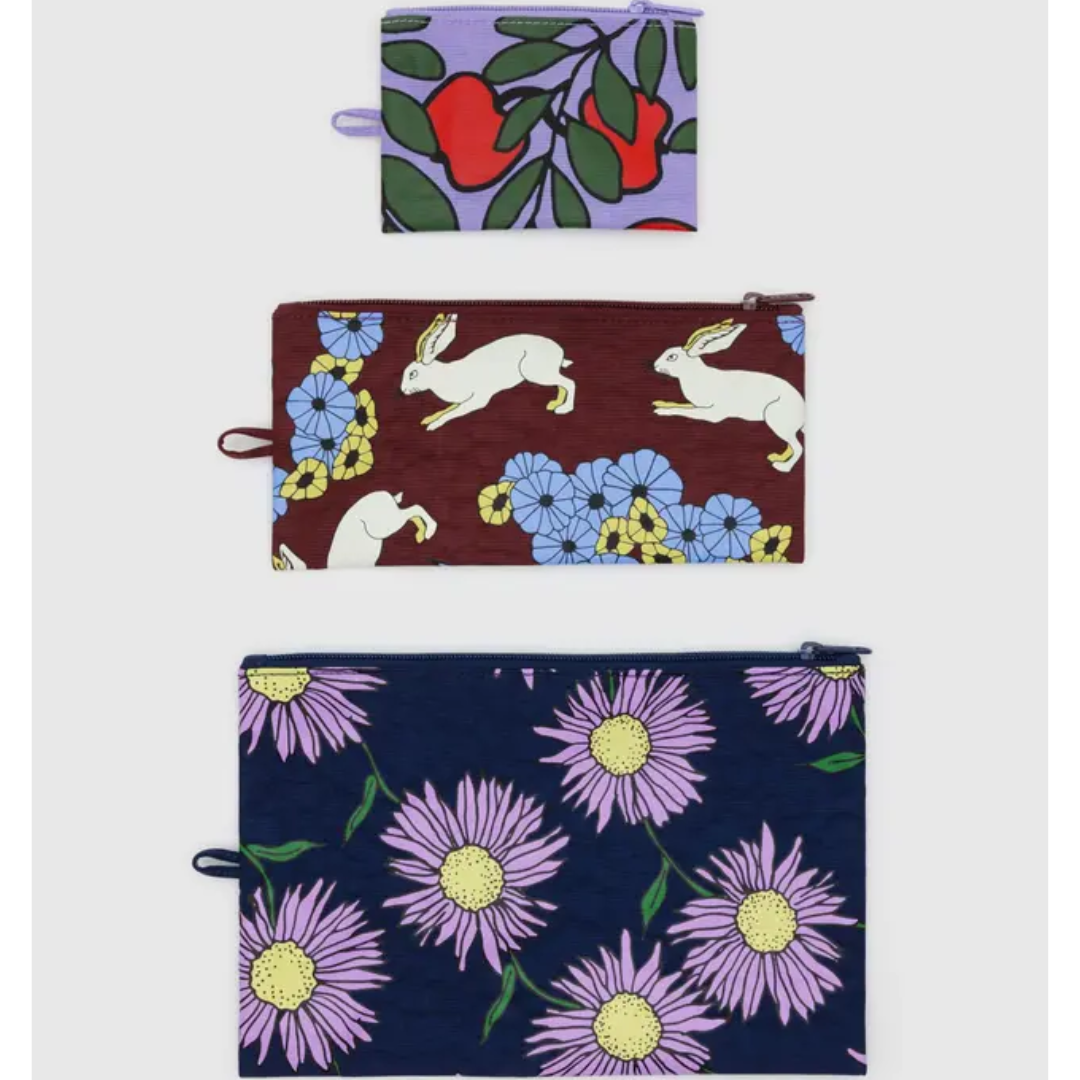 Three flora and fauna decorated flat pouches- small, medium, and large