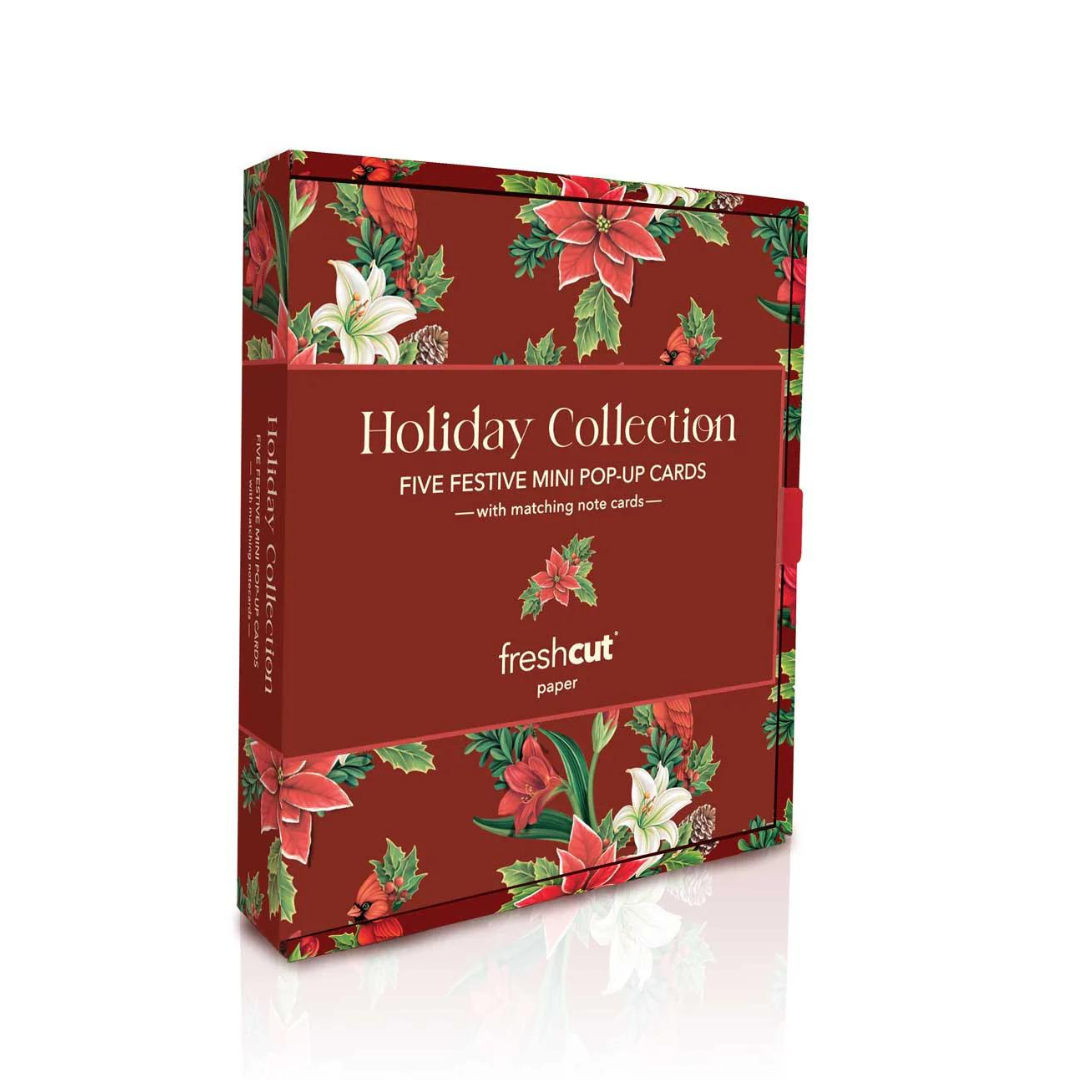 Red holiday box featuring poinsettias with the words "Holiday Collection: Five Festive Mini Pop-Up Cards".