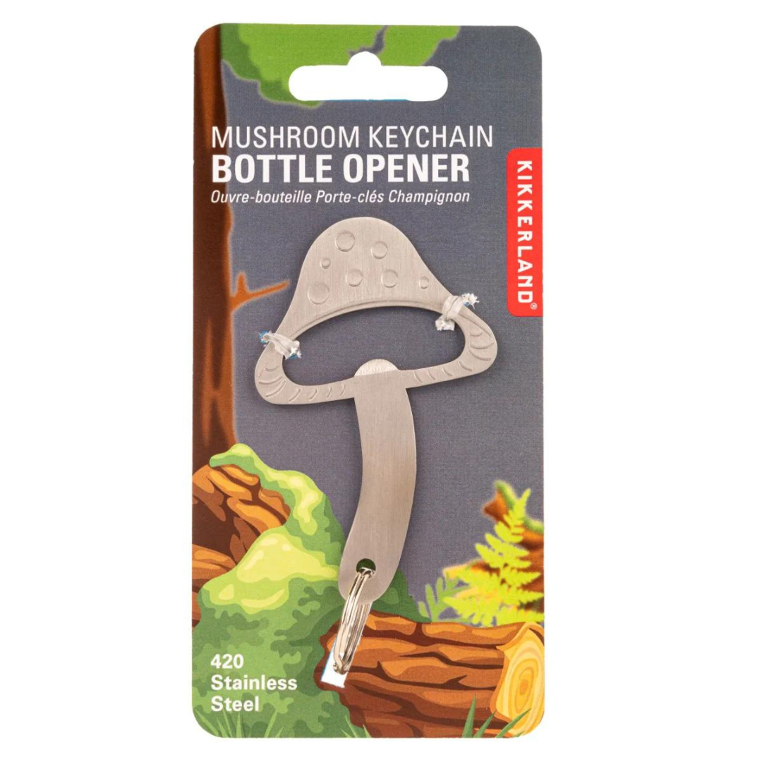 Silver mushroom shaped bottle opener in paper packaging featuring the words "mushroom keychain bottle opener".