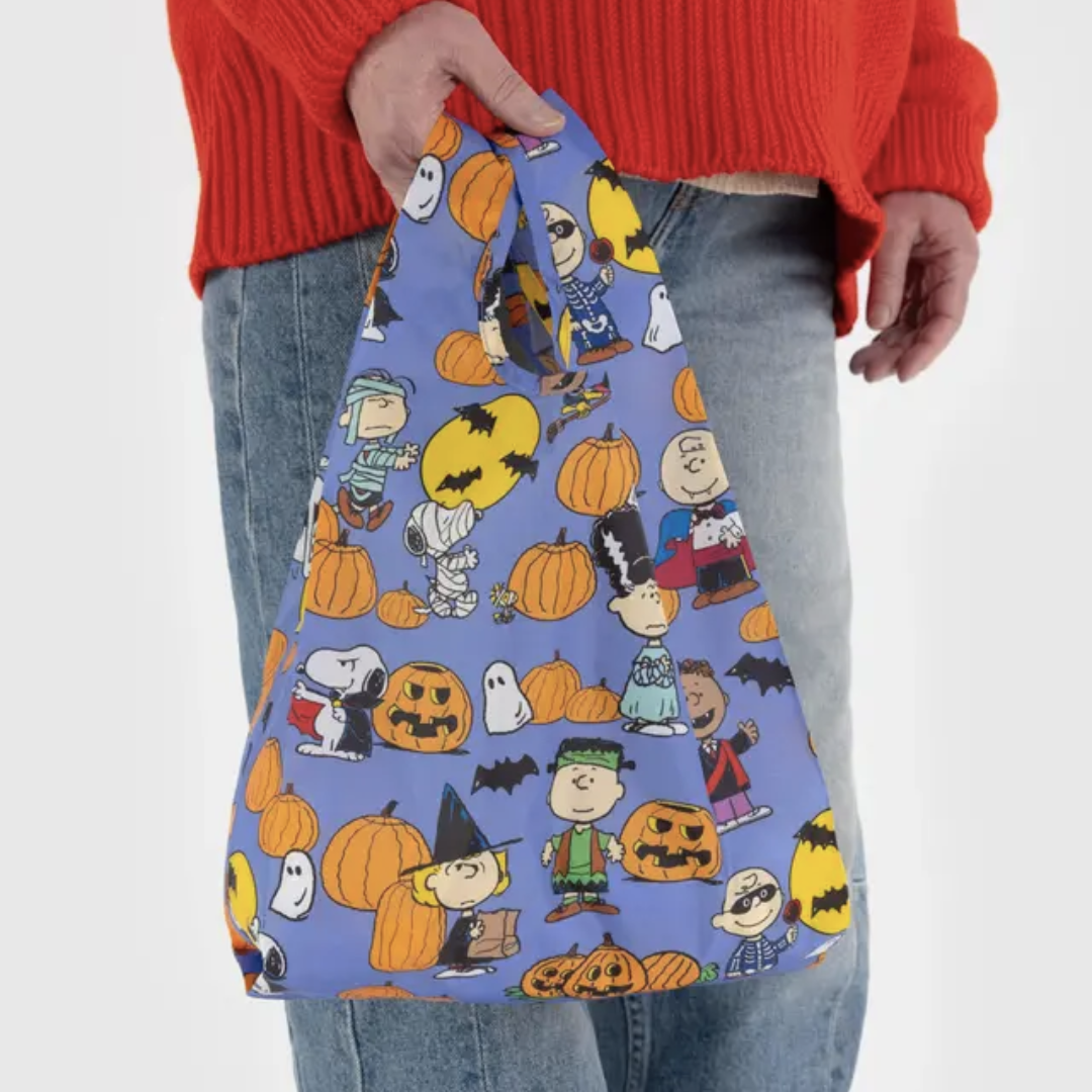 Model holds baby baggu for scale
