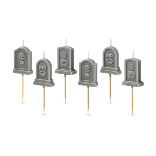 Set of six gray tombstone-shaped candles on toothpicks