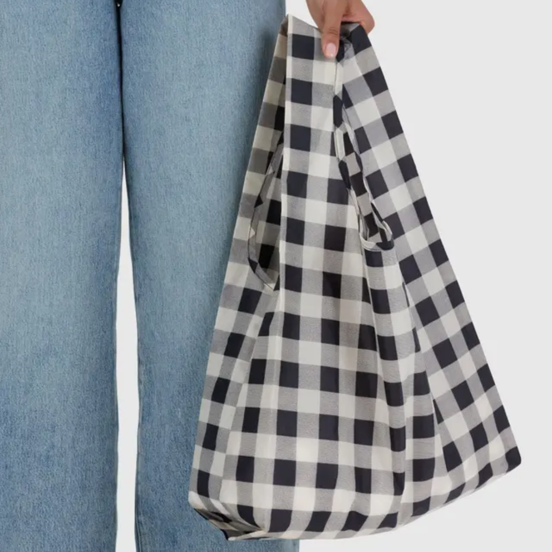 Model holding the shopping bag
