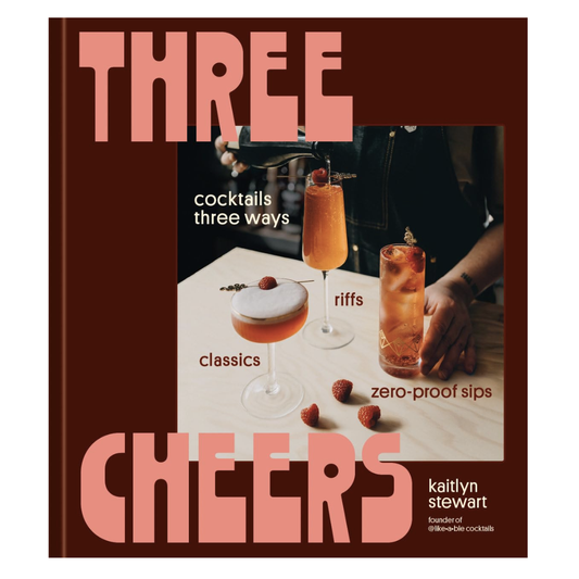 Cover for "Three Cheers: Cocktails Three Ways- Classics, Riffs, Zero-proof Sips" is maroon with a retro vibe and shows 3 different cocktails with a bartender serving them up