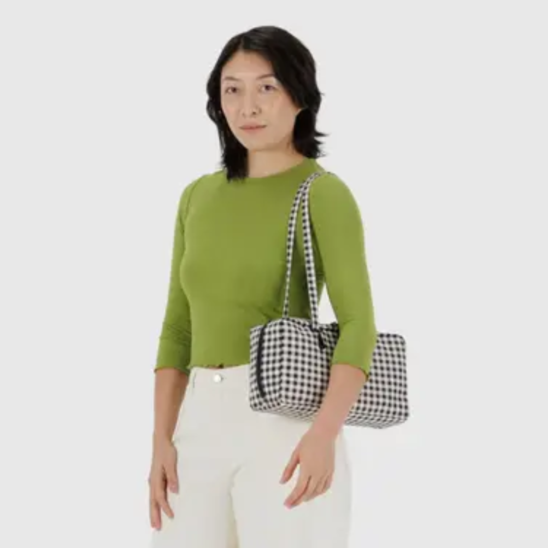 Woman holding the bag for scale