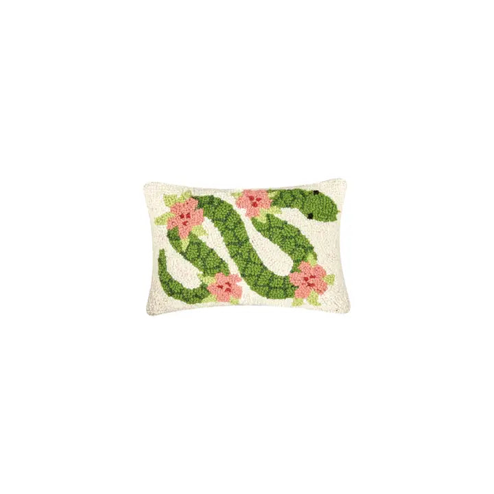 Pillow featuring a green snake decorated with pink flowers on a cream background