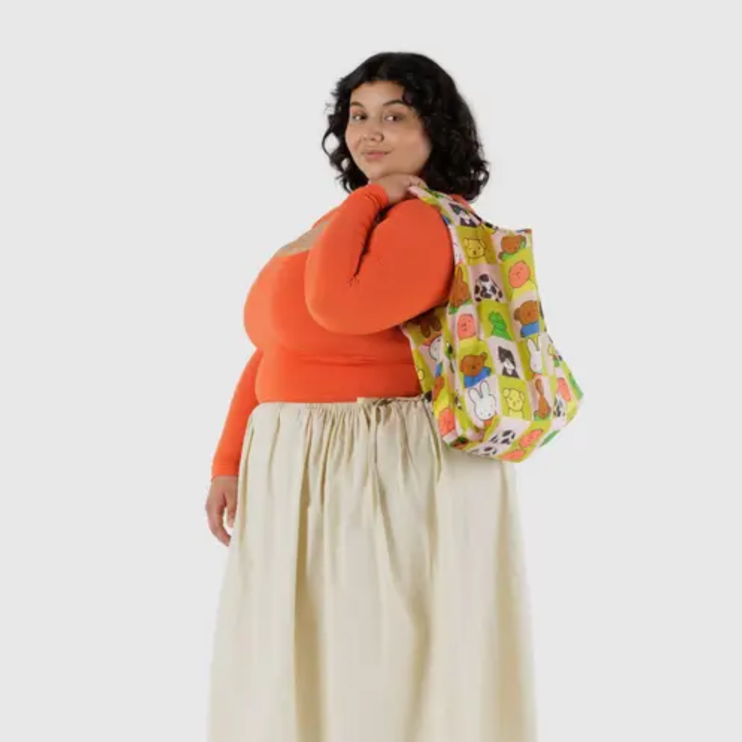 Model holding standard baggu shopping bag