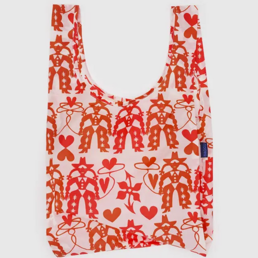 Red and white shopping bag with a cowgirl motif