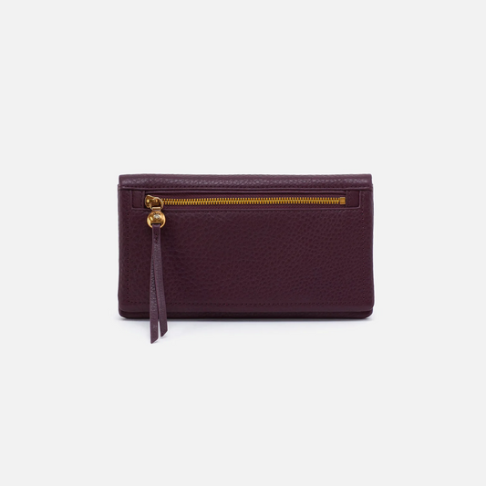 a red wine colored leather wallet with gold zipper