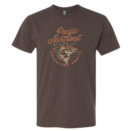 Brown t-shirt with a salmon jumping up against water, mountains, and sky that says 'Pacific Northwest Adventure Awaits' 