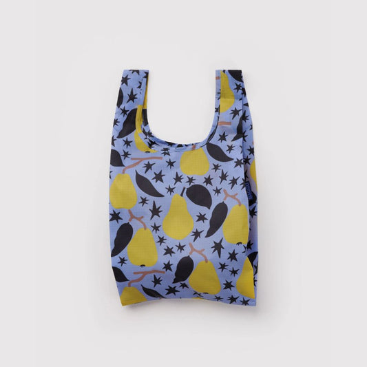 A reusable fabric shopping bag with a light blue background and a pattern of yellow pears and black stars, shown against a plain light gray background.