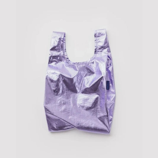A metallic lavender reusable shopping bag with a small dark blue tag on the side, photographed flat against a light gray background.