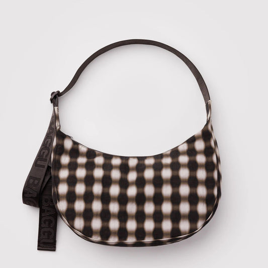 Black and white checkered handbag on a light gray background