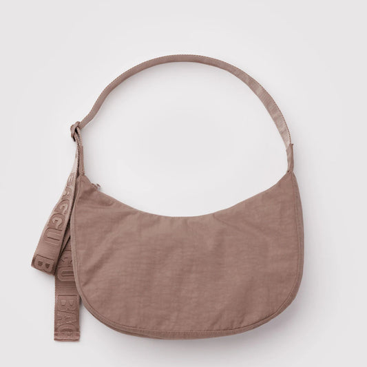Brown shoulder bag on a light gray background