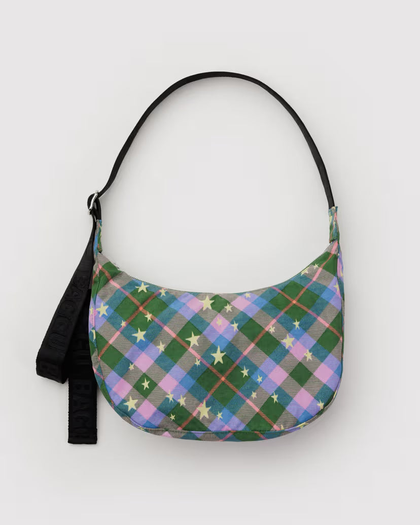 Plaid patterned handbag with a black strap on a white background