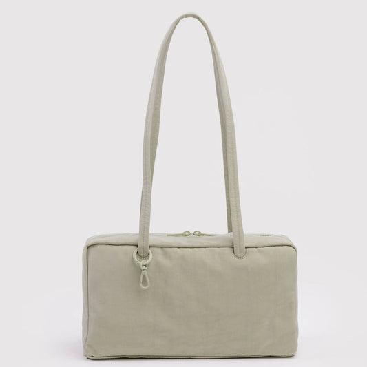 Celadon handbag with a strap on a white background