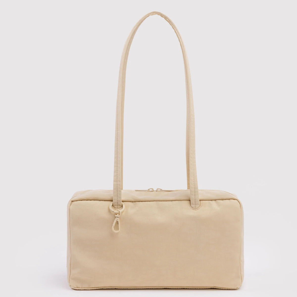 Beige handbag with a strap on a white background
