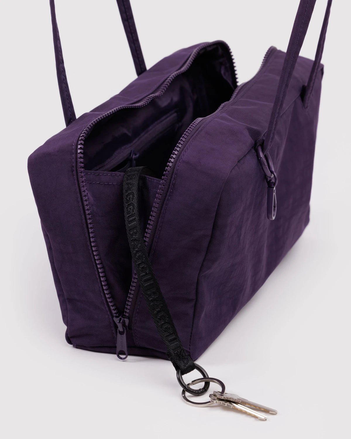 Purple bag with a zipper on a white background