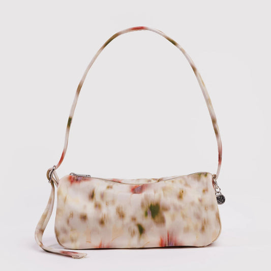 Floral patterned handbag on a white background