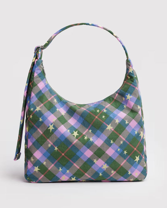 Plaid patterned handbag with star accents on a light gray background