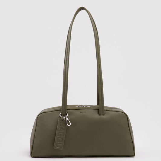 Green handbag with a visible brand tag on a light gray background