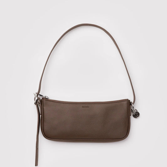Brown shoulder bag on a light gray background