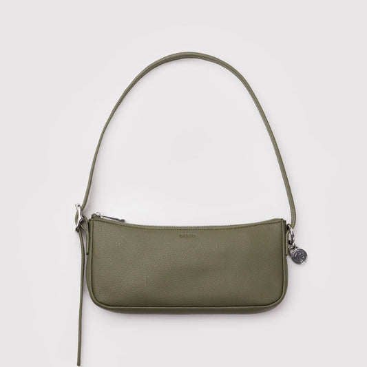 Green shoulder bag on a light gray background