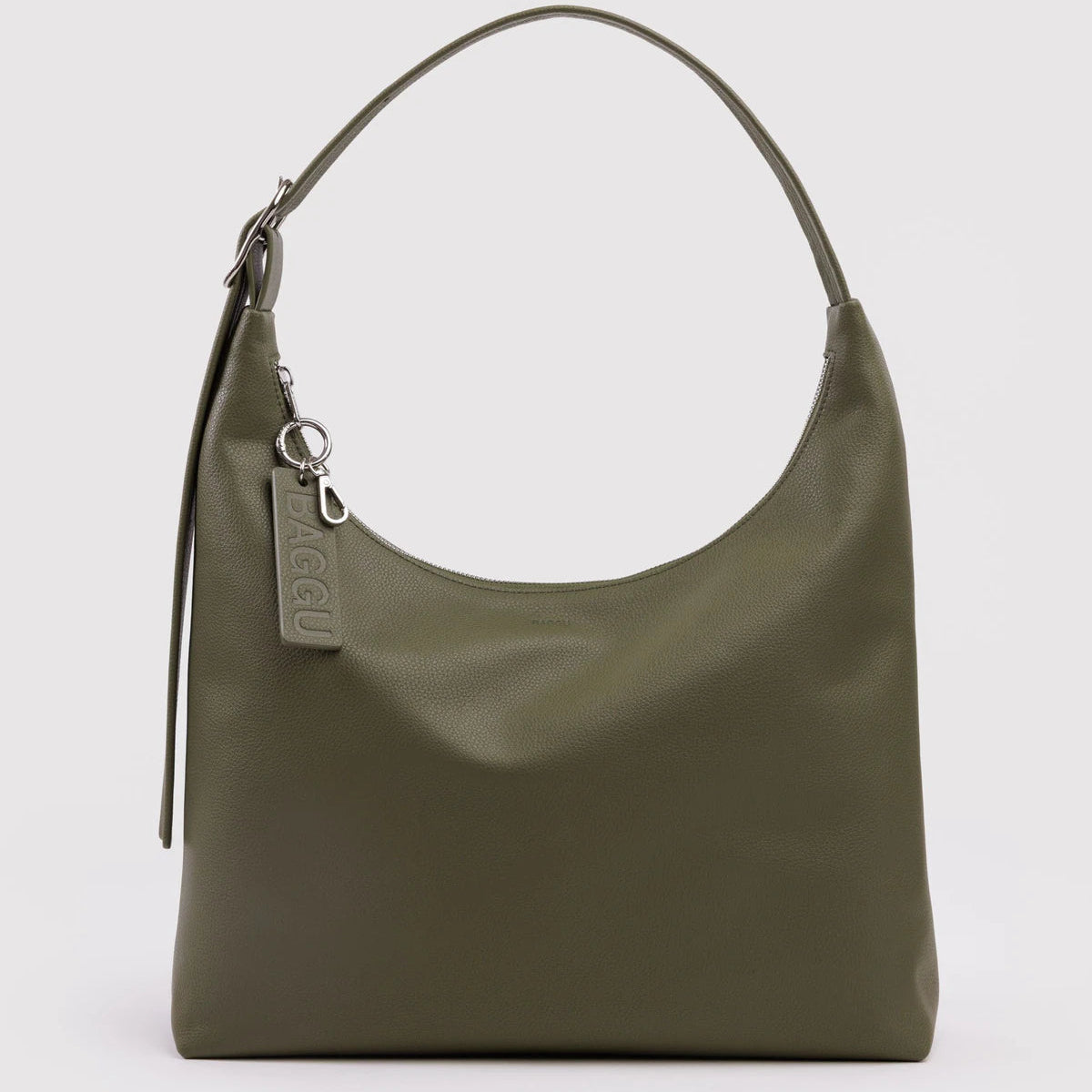 Green handbag with a visible brand tag on a light gray background
